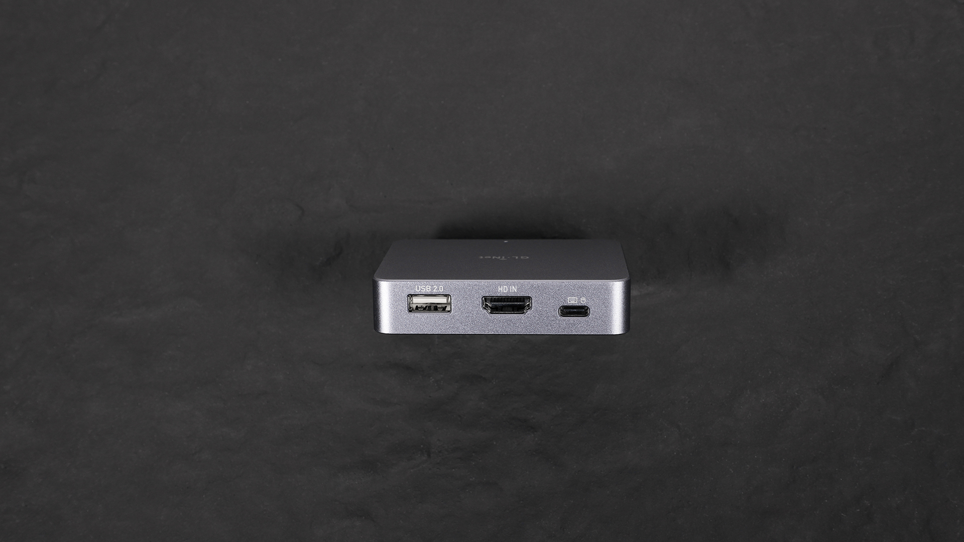 Front view of the GL.iNet Comet (GL-RM1) KVM device showing labeled ports: USB 2.0, HDMI, and USB-C.