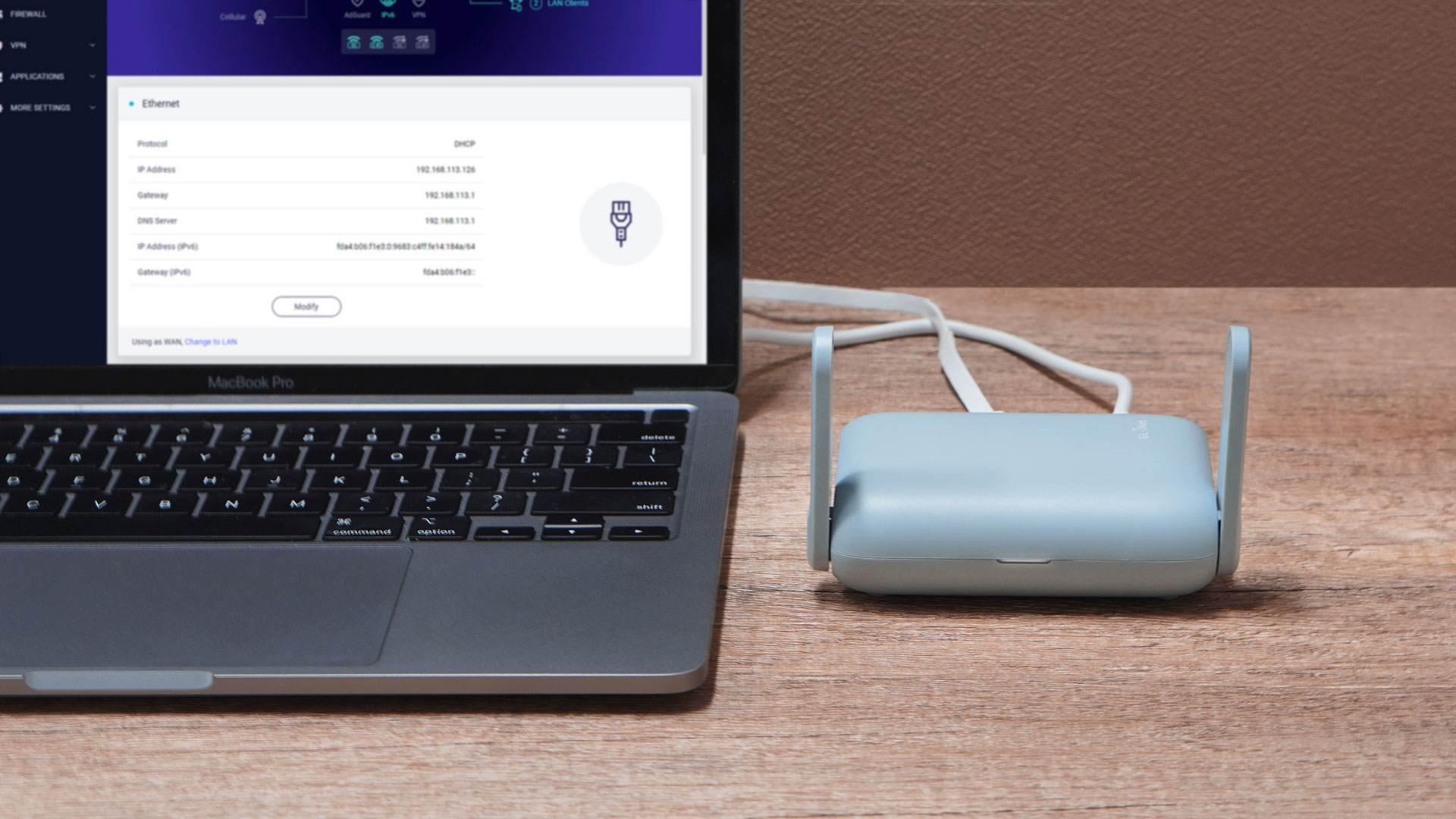 Beryl AX (GL-MT3000) connected to a laptop displaying its admin panel